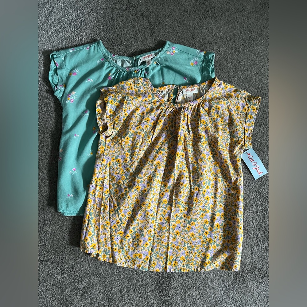 Set of 2 girls woven short sleeve tops, one new with tags.